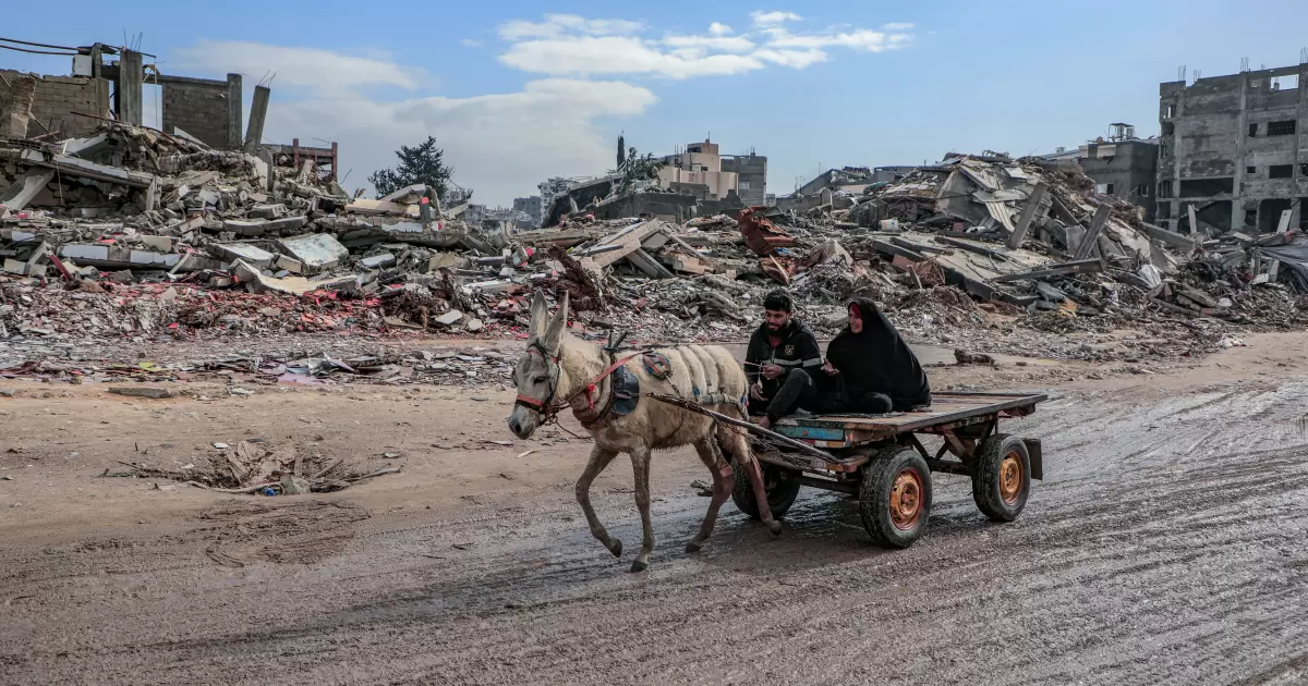 Gaza-Palestine Amid the massive destruction in Jabalia camp, a young man and his mother drive a cart through the camp's streets - Photo by Mohammed Ibrahim on Unsplash