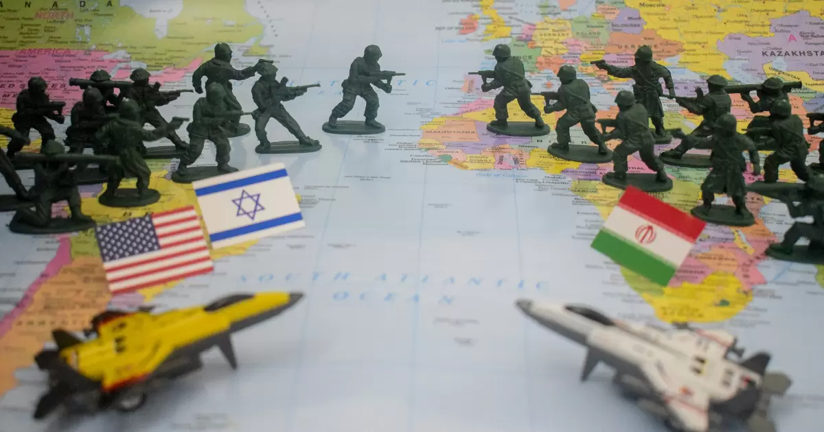 Toy soldiers and flags on world map - Photo by Saifee Art on Unsplash