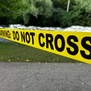 A "Warning: Do Not Cross" caution tape barrier. - Photo by Ted Balmer on Unsplash
