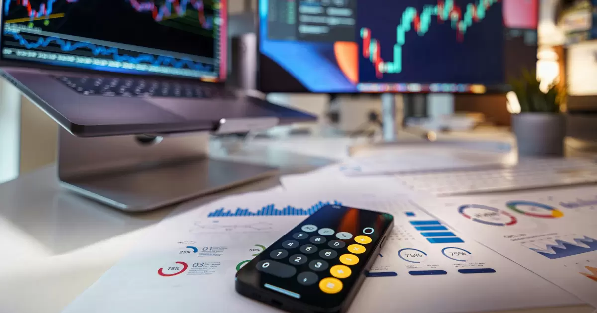 Currencies and finance. Stock exchange. Calculator on the table - Photo by Jakub Żerdzicki on Unsplash
