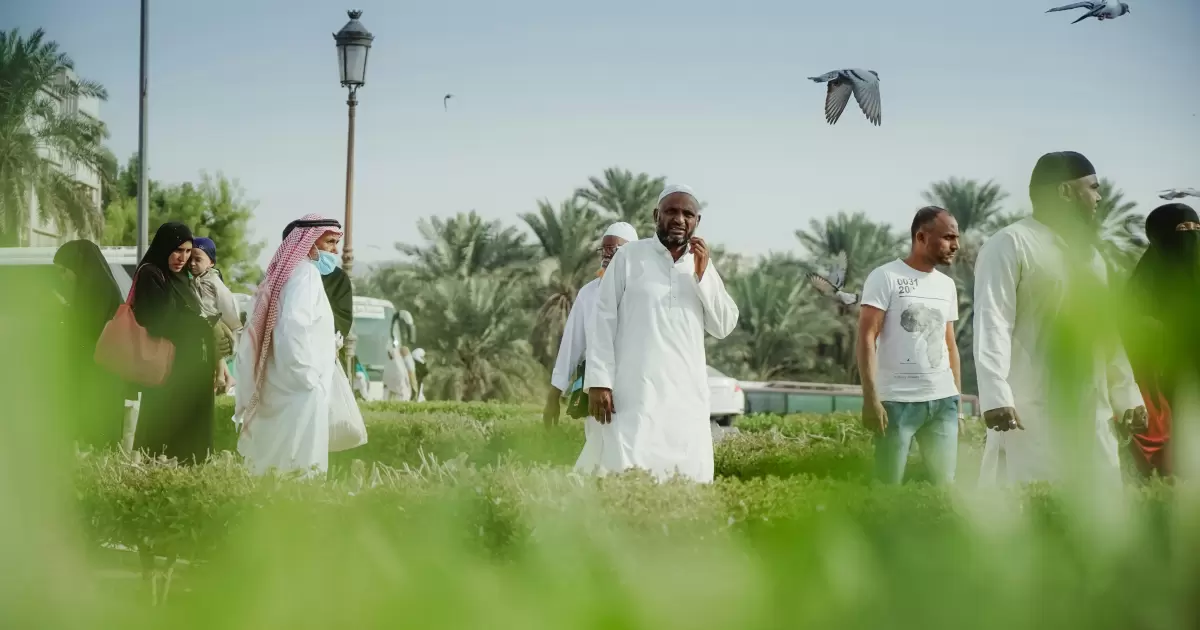 muslim pilgrims in white traditional clothes - Photo by Afif Ramdhasuma on Unsplash