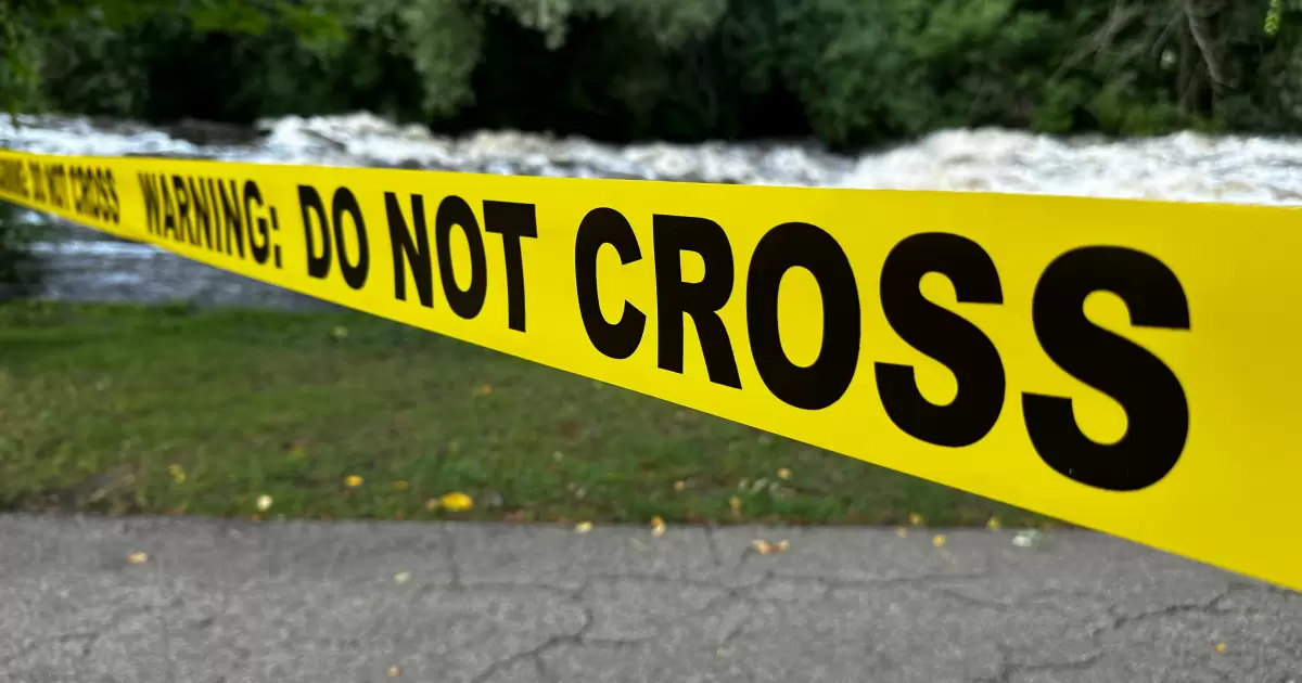 A "Warning: Do Not Cross" caution tape barrier. - Photo by Ted Balmer on Unsplash